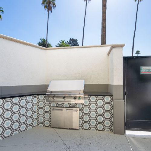 Outdoor stainless-steel grill built into the countertop